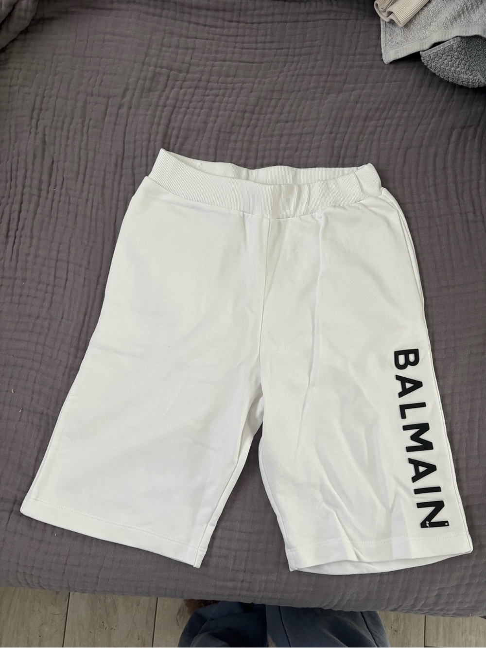 Balmain White Shorts with Black Vertical Logo